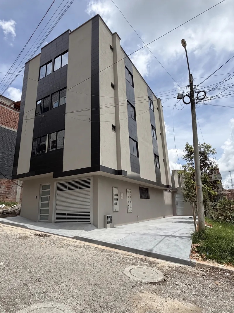 Render de la esquina del Edificio Roma terminado, con la fachada lateral en pintura gris y fachaleta negra